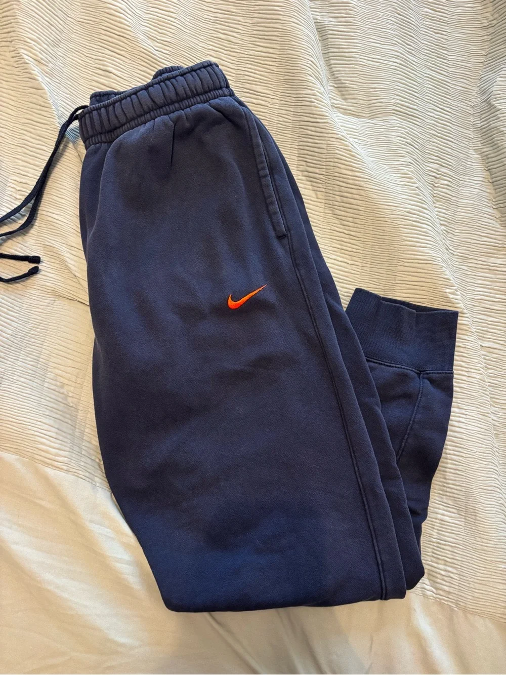 Nike Boys Navy Sweatpants with Orange Swoosh